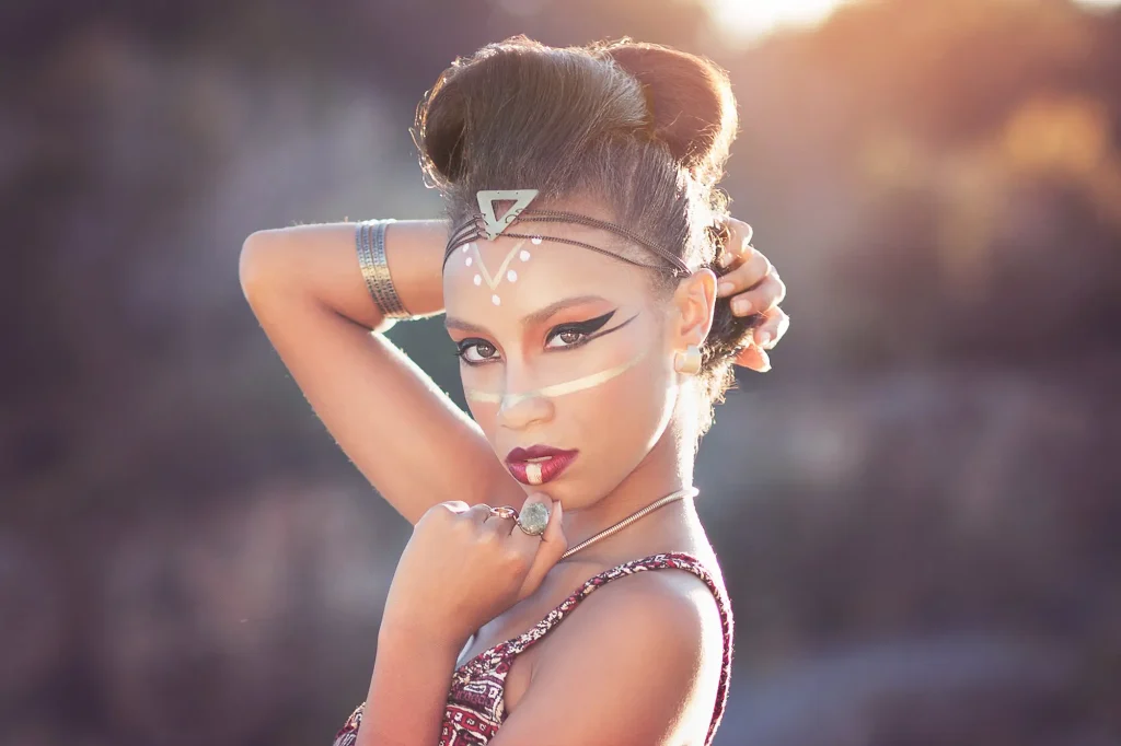 bold, dramatic makeup look for editorial portrait session with Cleopatra vibes - gold lines and bold red lip
