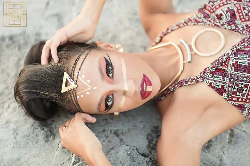 bold, dramatic makeup look for editorial portrait session with Cleopatra vibes - gold lines and bold red lip